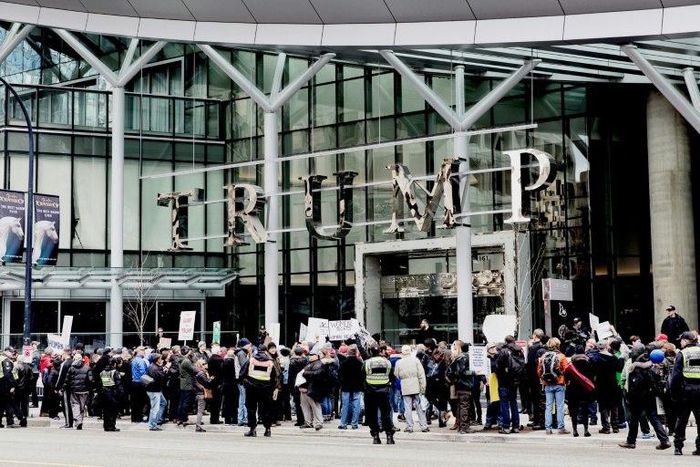 Protesters demonstrate in front of the Trump International Hotel and Tower in Vancouver on its opening day