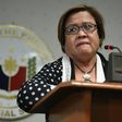 Philippine Senator Leila De Lima fights back tears as she speaks to reporters in Manila, on February 23, 2017