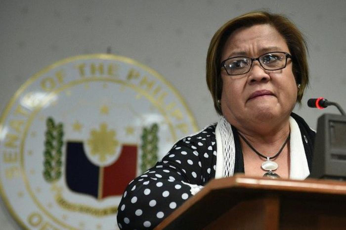 Philippine Senator Leila De Lima fights back tears as she speaks to reporters in Manila, on February 23, 2017