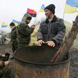 Ukrainian nationalist protesters and military veterans take part in a blockade against ongoing trade with Russian-backed insurgents at Kryvyi Torets railway station, in the Donetsk region, on February 23, 2017 The blockade consists of four different ca...