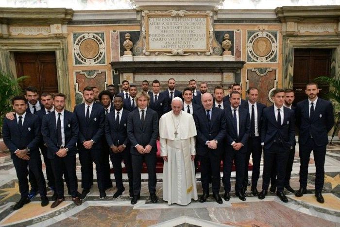 Pope Francis posing with members and players of the Juventus and Lazio teams at the end of an audience with Juventus and Lazio players on the eve of the Tim Cup final