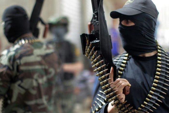 Islamic Jihad fighters chant anti-Israel slogans during a 2013 rally in the Gaza Strip refugee camp of Jabalia