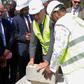 Guinean President Alpha Conde (R) and French Foreign Minister Jean-Marc Ayrauit (C) put the first stone of the upcoming Pasteur Institute in Conakry on November 11, 2016