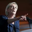 French presidential election candidate for the far-right Front National (FN) party Marine Le Pen gestures as she delivers a speech during a campaign meeting at the Palais des Congres in Ajaccio on the island of Corsica on April 8, 2017