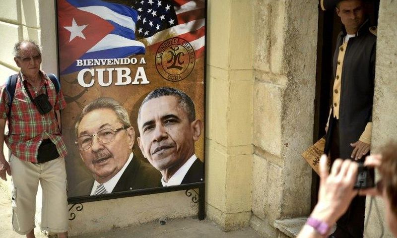 A poster in Havana shows Cuban and US Presidents Raul Castro and Barack Obama, who in December 2014 announced simultaneously their nations would normalize relations