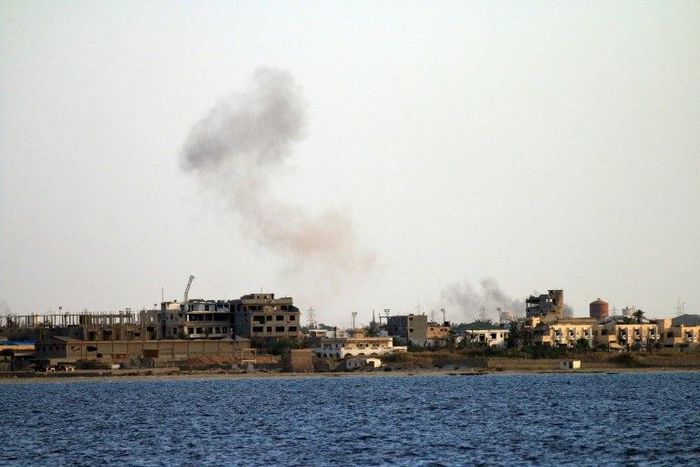 Smoke billows from buildings in the residential district of Gandoufa, in southwestern Benghazi, during clashes between Islamic State group's jihadists and the Libyan National Army