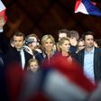 Emmanuel Macron with his wife Brigitte and members of her family at a victory party after his resounding win over far-right rival Marine Le Pen