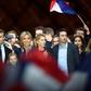 Emmanuel Macron with his wife Brigitte and members of her family at a victory party after his resounding win over far-right rival Marine Le Pen