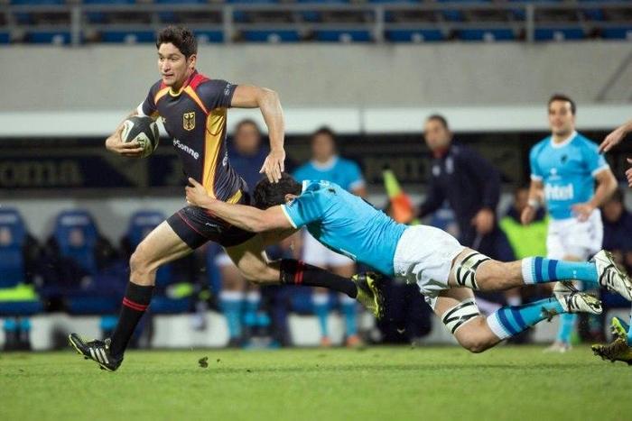 Germany's Christopher Hilsenbeck (L) vies with Uruguay's Gonzalo Soto on November 12, 2016 in their first Autumn international series
