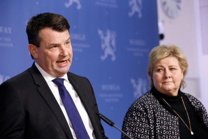 Norwegian Prime Minister Erna Solberg said she would miss justice minister Tor Mikkel Wara (L) who resigned after his partner allegedly faked attacks on the couple