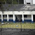 A policeman patrols outside the Stage II Male Juvenile Detention Center in San Jose Pinula, before an operation to rescue four hostages held by inmates inside the prison on March 20, 2017
