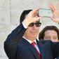 US Secretary of Treasury Steven Mnuchin snaps a picture with his smartphone at the end of a G7 summit of finance ministers where they pledged to combat cyber crime