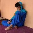 An Afghan boy, who was held as a child sex slave, sits at a restaurant in a unidentified location in Afghanistan