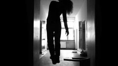 A body hanging from the ceiling of a house