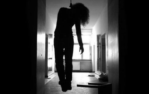 A body hanging from the ceiling of a house