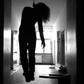 A body hanging from the ceiling of a house