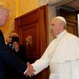 Pope Francis shakes hands with US President Donald Trump during a private audience at the Vatican