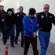 Turkish police escort people after their arrest for alleged links with US-based Muslim cleric Fethullah Gulen on April 26, 2017 in the central city of Kayseri