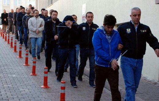 Turkish police escort people after their arrest for alleged links with US-based Muslim cleric Fethullah Gulen on April 26, 2017 in the central city of Kayseri