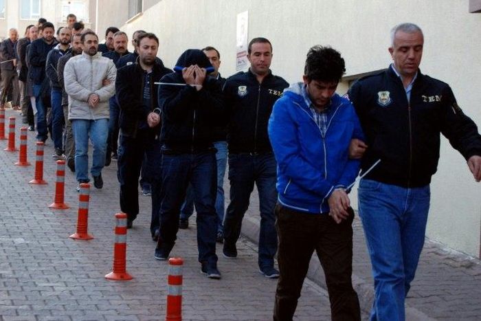 Turkish police escort people after their arrest for alleged links with US-based Muslim cleric Fethullah Gulen on April 26, 2017 in the central city of Kayseri
