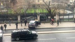 A picture obtained from the Twitter account of James West, shows a car stopped on the sidewalk in front of the Palace of Westminster which houses the Houses of Parliament in central London on March 22, 2017 during an incident