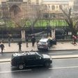 A picture obtained from the Twitter account of James West, shows a car stopped on the sidewalk in front of the Palace of Westminster which houses the Houses of Parliament in central London on March 22, 2017 during an incident