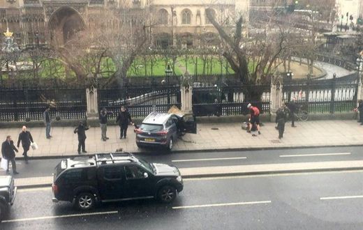 A picture obtained from the Twitter account of James West, shows a car stopped on the sidewalk in front of the Palace of Westminster which houses the Houses of Parliament in central London on March 22, 2017 during an incident