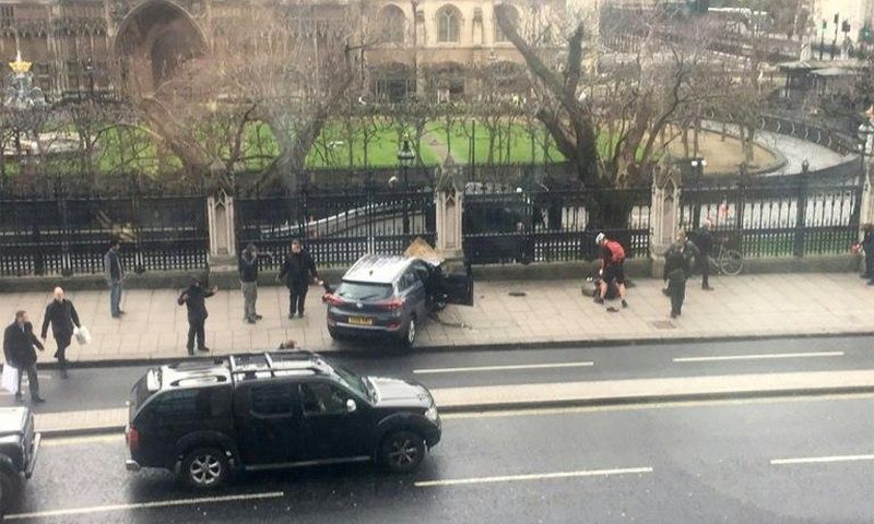 A picture obtained from the Twitter account of James West, shows a car stopped on the sidewalk in front of the Palace of Westminster which houses the Houses of Parliament in central London on March 22, 2017 during an incident