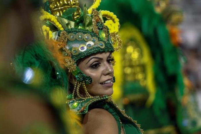 A reveller of "Unidos de Vila Maria" samba school performs during the second night of carnival in Sao Paulo