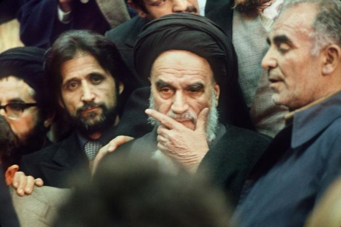 Ayatollah Ruhollah Khomeini surrounded by supporters in Tehran on February 1, 1979, on his return from exile