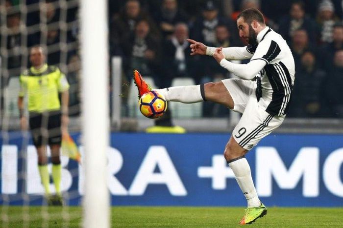 Juventus' forward Gonzalo Higuain from Argentina scores a goal during the Italian Tim Cup football match between Juventus and Napoli on February 28, 2017, at the Juventus Stadium in Turin