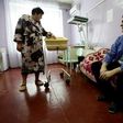 Ukranian woman Olena Gorbatova (L), plays with her baby as her husband Sergiy (R) looks on at the maternity hospital in the war-torn eastern city of Avdiivka.