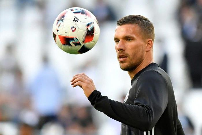Germany forward Lukas Podolski warms up before the Euro 2016 quarter-final football match against Italy in Bordeaux