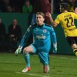 Dortmund's midfielder Christian Pulisic (R) celebrates scoring the opening goal during the German Cup DFB Pokal quarter-final football match Sportfreunde Lotte v BVB Borussia Dortmund, in Osnabruck, northern Germany on March 14, 2017