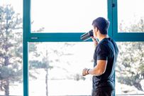 Young Man Drinking Protein Shake Indoors