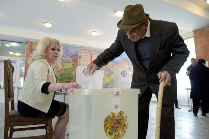 An elderly man casts his ballot at a polling station in Yerevan, the Armenian capital, in legislative elections. It is the first ballot since the adoption of constitutional reforms aimed at transforming the ex-Soviet country into a parliamentary republ...
