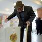 An elderly man casts his ballot at a polling station in Yerevan, the Armenian capital, in legislative elections. It is the first ballot since the adoption of constitutional reforms aimed at transforming the ex-Soviet country into a parliamentary republ...