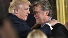 US President Donald Trump (left) congratulates Steve Bannon during a ceremony at the White House in January 2017