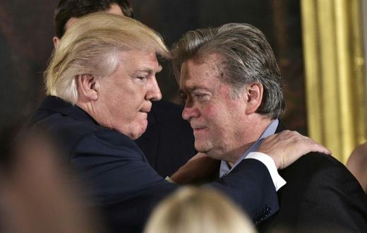 US President Donald Trump (left) congratulates Steve Bannon during a ceremony at the White House in January 2017