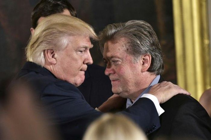 US President Donald Trump (left) congratulates Steve Bannon during a ceremony at the White House in January 2017