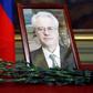 Flowers are laid in front of a portrait of Russia's Ambassador to the United Nations Vitaly Churkin at the Foreign Ministry guest house in Moscow on February 21, 2017