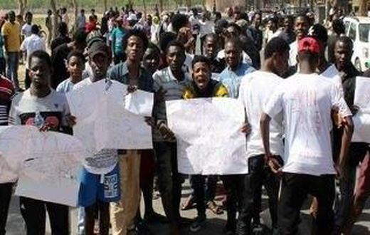 Protesters protesting the xenophobic attacks in India