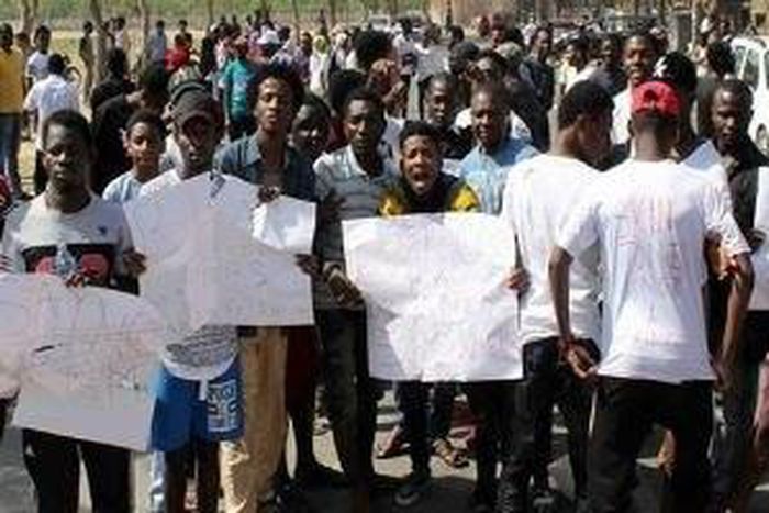 Protesters protesting the xenophobic attacks in India