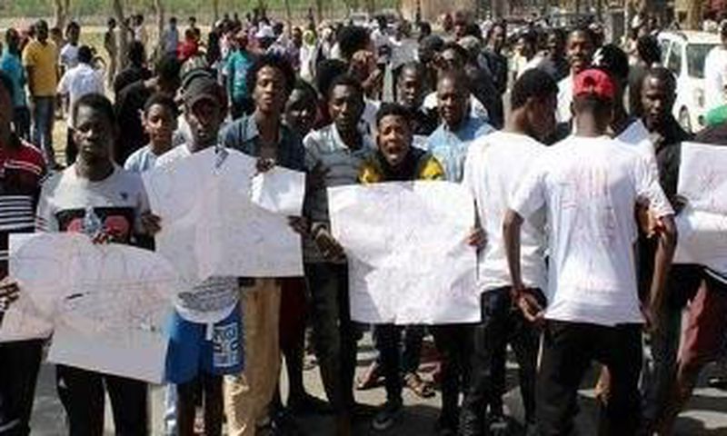 Protesters protesting the xenophobic attacks in India