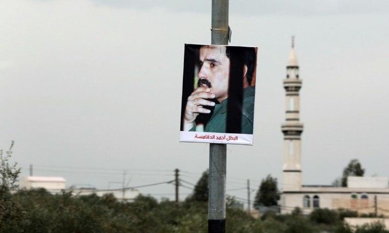 A portrait of Ahmad Dakamseh hangs in the Jordanian city of Irbid on the day of his release after serving 20 years in prison