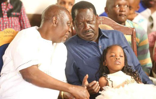 ODM party leader Raila Odinga speaks with hie elder brother Oburu Odinga at a past public event