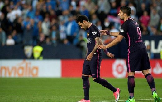 Barcelona's Brazilian forward Neymar da Silva (L) walks off the pitch during the Spanish league football match Malaga CF vs FC Barcelona at La Rosaleda stadium in Malaga on April 8, 2017