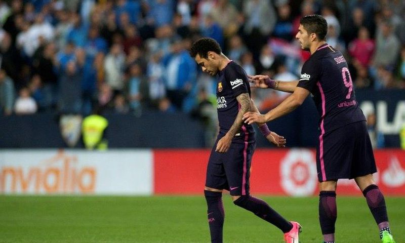 Barcelona's Brazilian forward Neymar da Silva (L) walks off the pitch during the Spanish league football match Malaga CF vs FC Barcelona at La Rosaleda stadium in Malaga on April 8, 2017