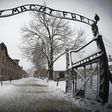 A group of seven men and four women -- Poles, Belarussians and one German -- carried out the unprecedented stunt in front of Auschwitz's infamous "Arbeit macht frei" gate, where they draped a white banner with "love" written in red