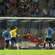 Paulinho (2nd-L) scores the second of his three goals as Brazil thrash Uruguay 4-1 in World Cup qualifiers